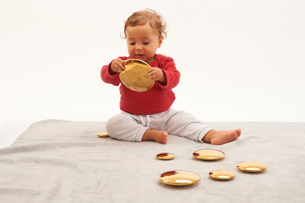 Baby with Sensory Reflective Gold Balls 